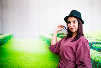 Naklejka premium Beautiful girl drinking coffee at the coffee shop