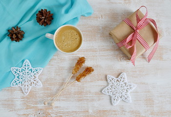 Cup of Coffee with Christmas Decorations on Wooden table, Snow Down, Toned Photo