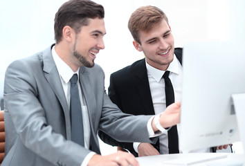 Fototapeta premium employees are talking sitting behind a Desk
