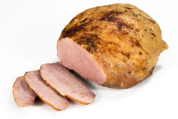 Partially sliced piece of smoked pork meat on a white background