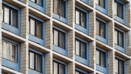 Facade of an old high-rise building. Urbanization concept
