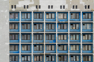 Fototapeta na wymiar Facade of an old high-rise building. Urbanization concept