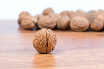 A lot of scattered walnuts close-up. A useful product.