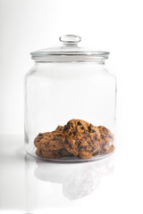 chocolate chop cookies biscuits in a cookie jar of glass isolated on white background with copy space 