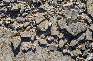 Destroyed concrete floor texture. Large broken pieces of concrete background