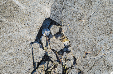 Destroyed concrete floor texture. Large broken pieces of concrete background