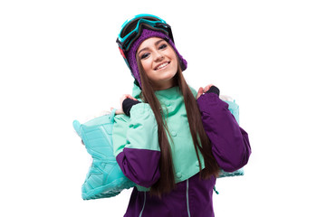 cheerful young pretty woman in purple ski coat and goggles