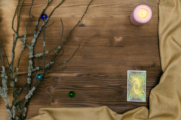 Tarot cards deck on wooden table with copy space. Fortune teller table.