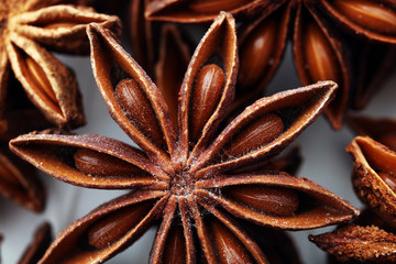 Anise star seeds on the wooden background. Aromatic ingredient in culinary