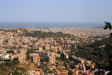 Fototapeta na wymiar View on Barcelona city and mediterranean sea from Tibidabo hill