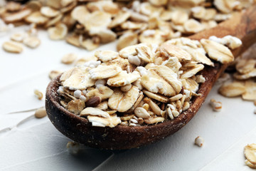 Healthy food concept with oats meal on white background.