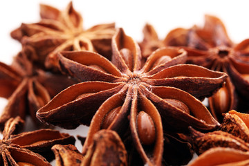 Anise star seeds on the wooden background. Aromatic ingredient in culinary