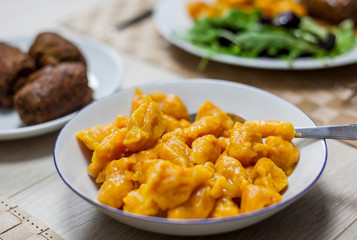 Carrot noodles, beef roulades and salad with beets and rocket salad