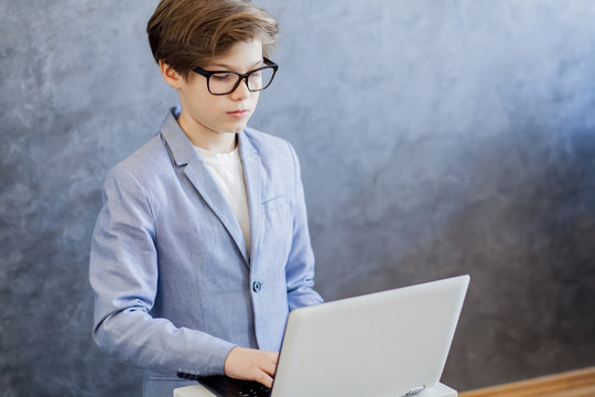 Teen boy using laptop