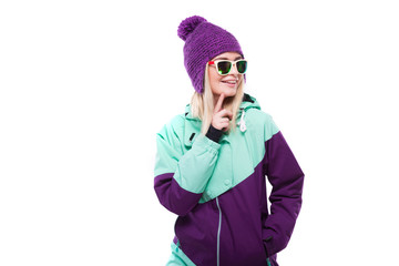 young attractive woman in purple ski suit