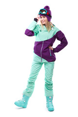 young beautiful woman in purple ski suit and blue snow boots