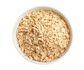 Bowl with raw oatmeal on white background