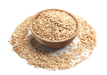 Bowl with raw oatmeal on white background