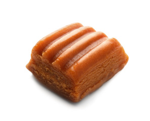 Sweet caramel candy on white background