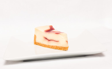 Cheesecake slice on white plate , isolated on white background