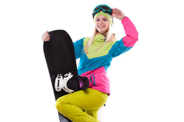 beautiful young woman in ski outfit and ski glasses hold snowboard