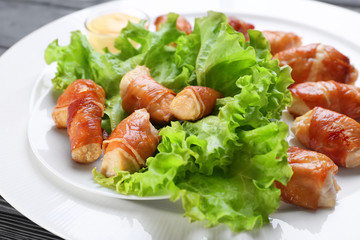 Bacon wrapped chicken on plate, closeup