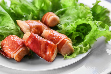 Bacon wrapped chicken on plate, closeup