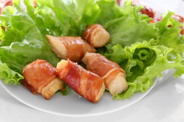 Bacon wrapped chicken on plate, closeup