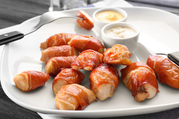 Bacon wrapped chicken on plate, closeup