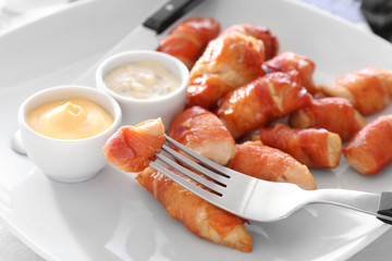 Bacon wrapped chicken on plate, closeup