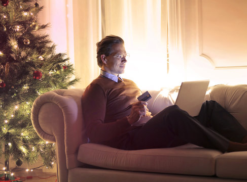 Man buying Christmas presents online