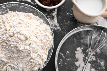 Bowl with flour on table