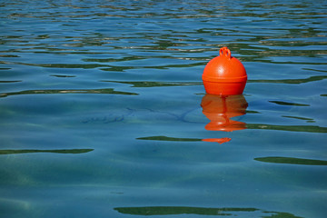 one red buoy and a sea