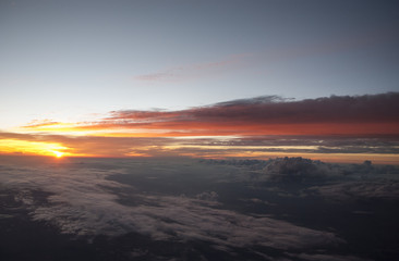 Fototapeta na wymiar Sunset from above the clouds