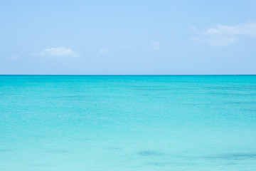A perfect horizon line between turquoise sea water and blue sky. Caribbean, Turks and Caicos Islands. 