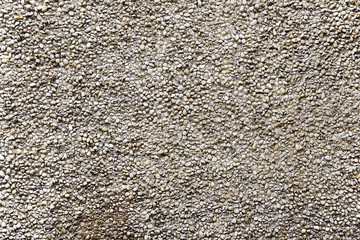 Old beige stone wall background texture