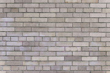 Old grey brick wall background texture