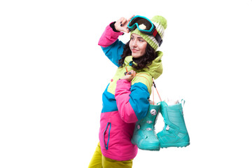 beautiful young woman in ski outfit and ski goggles blue snow boots