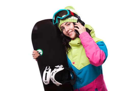 beautiful young woman in ski outfit and hold snowboard
