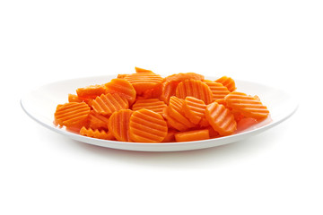 Sliced carrot on white plate, isolated on white background