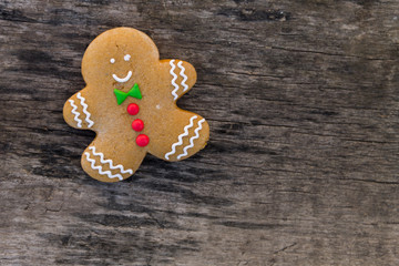 Christmas gingerbread man on rustic wooden table