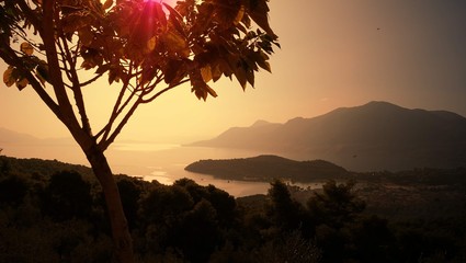Suburbs Of Corinth. Greece/Scenic views of shores of the Aegean sea, at sunset. Early spring. From a trip to Mediterranean - obrazy, fototapety, plakaty