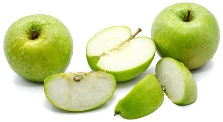 Sliced apple Granny Smith, two whole, three slices and one half, isolated on white background 