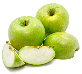 Granny Smith apples, two whole, sliced and one half, isolated on white background