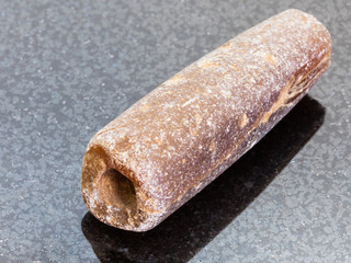 thunderstone fossil on dark granite background