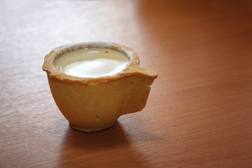 Cup of the dough is on the table