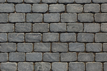 Overhead view of cobblestone street texture. Stone pavement texture.