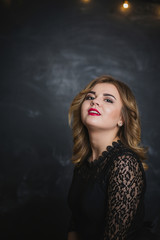 portrait of a blonde on a black background