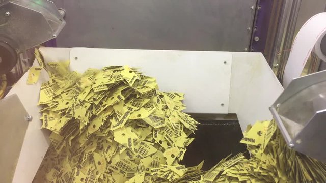 Ticket Shredder Cutting Up Used Tickets