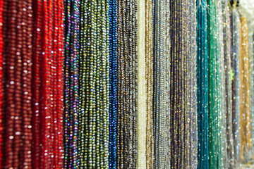 The texture of the beads in red and multicolored tones